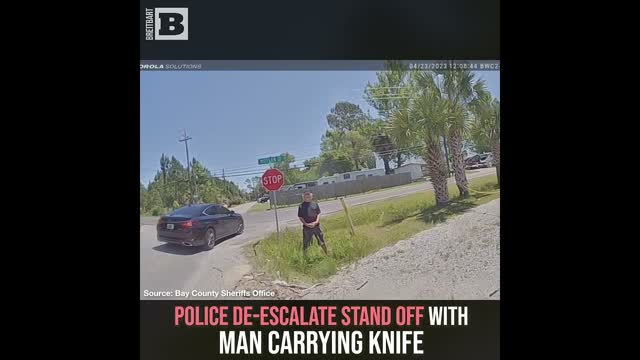 Police De-Escalate Stand Off with Man Carrying Knife
